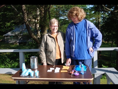Nurses Lynn and Mary prepare to distribute meds