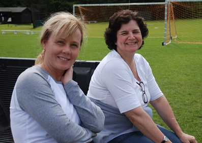 Leslie and Teresa, nurses, watch from the sidelines