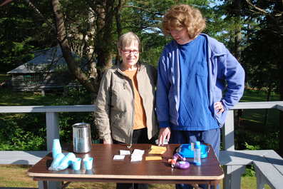 Nurses Lynn and Mary prepare to distribute medications