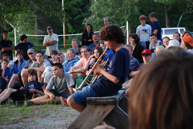 Boys of all ages perform at campfire
