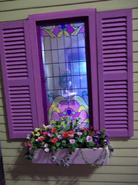 The stained glass window looks just beautiful with the chosen paint colors! Love the mini flowers.