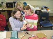 TSA middle schoolers build mini generators to learn about electricity.