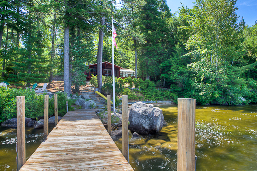 New Lake Winnipesaukee real estate listing 07/12/2010:&nbsp;This new Moultonborough Lake Winnipesaukee real estate listing, listed by Nicole Watkins of CENTURY 21 Lakes Region Realty, is sited on .91 acres on a magnificent point of land with 190 ft. of crystal clear Lake Winnipesaukee waterfront. The landscape of 69 Jeremiah Smith Road, Moultonborough, NH features a sandy beach, stone walkways, and a 55 ft. permanent dock. 2 lakeside patios have stunning views and can not be duplicated today. Beautiful breezes across the point and panoramic views are two features found on rare properties such as this that have Lake Winnipesaukee on two sides of the home and landscape. One level 3 bedroom cottage has a Master Bedroom with Bath, screen porch, beautiful, big lake and mountain views, wood stove and fireplace. Use the cottage as is, renovate, or use the architectural schematics that the owner has already purchased to build your dream home on Lake Winnipesaukee. 